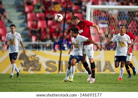 BANGKOK,THAILAND-JULY13:Michael Carrick (R2)of Manchester United in action during the friendly match between Singha All Star and Manchester United at Rajamangala Stadium on July 13, 2013 in Thailand.