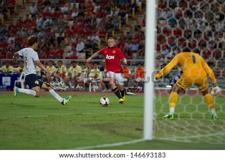 BANGKOK,THAILAND-JULY13: Tom Cleverley (C) of Manchester United in action during the friendly match between Singha All Star and Manchester United at Rajamangala Stadium on July 13, 2013 in Thailand.