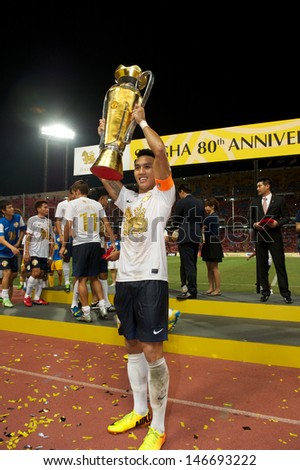 BANGKOK,THAILAND-JULY13:Teeratep W. Singha All Star celebrate with the trophy after the friendly match between Singha All Star and Manchester United at Rajamangala Stadium on July13,2013 in Thailand.