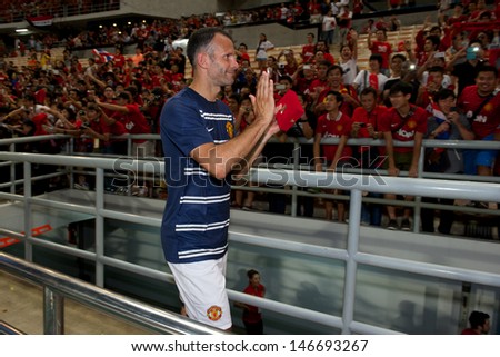 BANGKOK,THAILAND-JULY13: Ryan Giggs #11 of Manchester United in action during the friendly match between Singha All Star XI and Manchester United at Rajamangala Stadium on July 13, 2013 in Thailand.