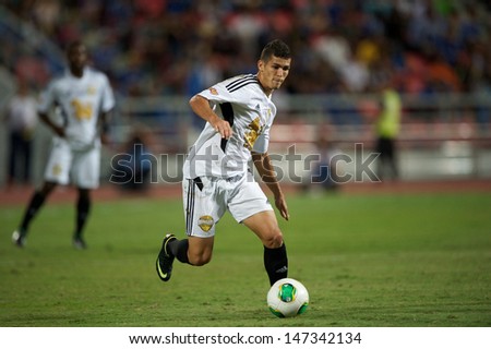 BANGKOK,THAILAND-JULY17:Cleiton Silva of Singha  All-Star in action during the international friendly match Chelsea FC and Singha All-Star at the Rajamangala Stadium on July17,2013 inThailand