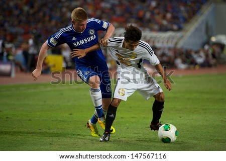 BANGKOK,THAILAND-JU LY17:Chanathip Songkrasin(R)of Singha All-Star in action during the international friendly match Chelsea FC and Singha All-Star at the Rajamangala Stadium on July17,2013 inThailand