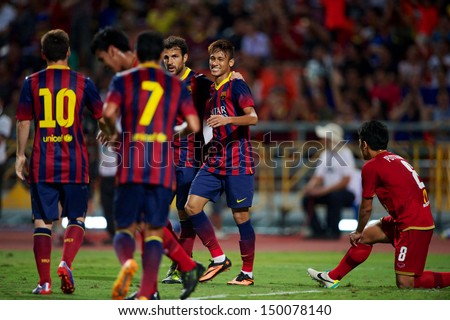 BANGKOK,THAILAND-AUGUST07:Neymar JR R2 of FC Barcelona celebrates with team mate during the international friendly match Thailand  and FC Barcelona at Rajamangala Stadium on August 7,2013 in,Thailand.
