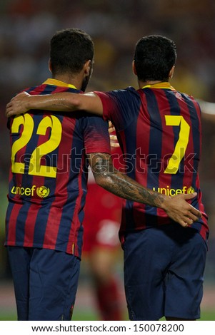 BANGKOK,THAILAND-AUGUST07:Pedro #7 of Barcelona is congratulated by team mates during the international friendly match Thailand XI and FC Barcelona at Rajamangala Stadium on August 7,2013 in,Thailand.