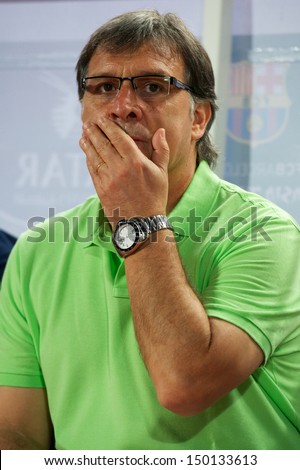 BANGKOK,THAILAND-AUGUST07:Manager Gerardo Martino  of FC Barcelona look on during the international friendly match Thailand XI and FC Barcelona at Rajamangala Stadium on August 7,2013 in,Thailand.