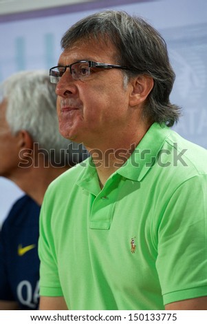 BANGKOK,THAILAND-AUGUST07:Manager Gerardo Martino  of FC Barcelona look on during the international friendly match Thailand XI and FC Barcelona at Rajamangala Stadium on August 7,2013 in,Thailand.