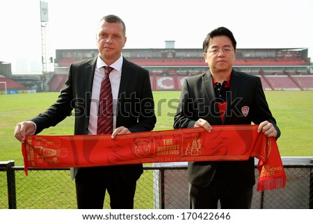 NONTHABURI THAILAND-Jan 3:New Manager Scott Cooper (L) with Vice-President Wiluck Lohtong during his press conference as for SCG Muangthong United at SCG Stadium on Jan 3,2014  Nonthaburi,Thailand