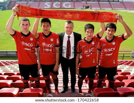 NONTHABURI THAILAND-Jan 3:New Manager	Scott Cooper (L3) pose for a photo with 4 new player of SCG MuangThong United during a press conference at SCG Stadium on Jan 3,2014 in Nonthaburi,Thailand