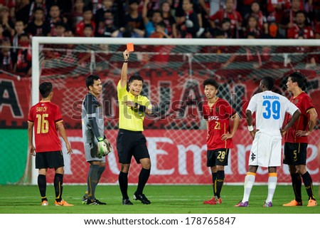 NONTHABURI-THAILAND FEB 8:Referee Dong Jin of Korea (yellow) show Red card during the AFC Champions League 2014 between Muangthong utd and Hanoi T&T at SCG Stadium on February 8, 2014 in Thailand