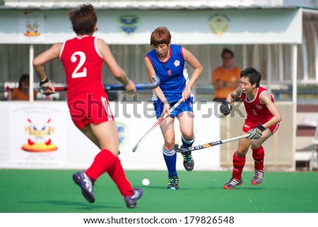 PATHUM THANI THAILAND-FEB 18:Yang Wan Wen(blue)of Taipei  control the ball during Women\'s Asian Games Qualifiers 2014 Taipei  and Hong Kong at QueenSirikit Stadium on February 18,2014 in Thailand