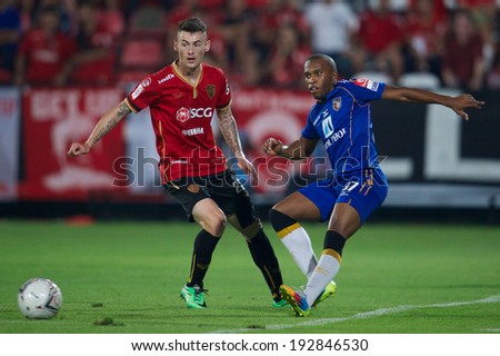 NONTHABURI THAILAND-March 26:Heberty Fernandes (blue)of Ratchaburi F.C.in action during Thai Premier League Muangthong utd.and Ratchaburi F.C. at SCG Stadium on March 26,2014 in Thailand