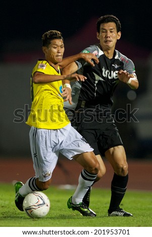 BANGKOK THAILAND-APRIL 05:	Pokklaw Anan (yellow) of Police United  in action during Thai Premier League Bangkok United and Police United at Thai-Japanese Stadiumon Apr 05,2014 in Thailand