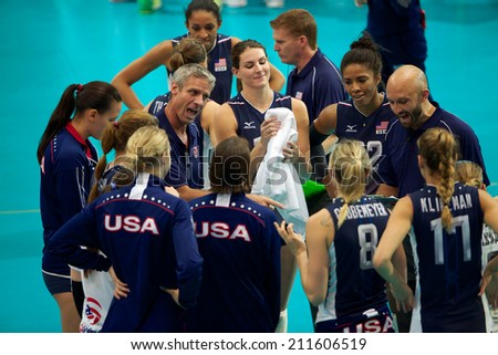 BANGKOK,THAILAND-AUGUST15:USA coach Karch Kiraly  USA (C)speaks with players the FIVB Women\'s World Grand Prix 2014  Brazil and USA at Indoor Stadium Huamark on Aug.15, 2014 in Thailand.