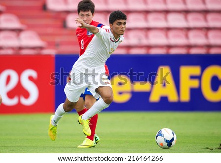 NONTHABURI THAILAND-SEPTEMBER 06:Salaah Said Salim Al Yahyaei (white) of Oman in action during the AFC U-16 Championship between Korea Republic and Oman at Muangthong Stadium on Sep 06, 2014, Thailand