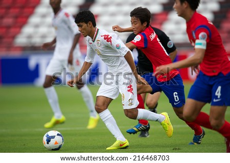 NONTHABURI THAILAND-SEPTEMBER 06:Salaah Said Salim Al Yahyaei (white) of Oman in action during the AFC U-16 Championship between Korea Republic and Oman at Muangthong Stadium on Sep 06, 2014,Thailand