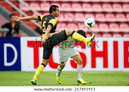 NONTHABURI THAILAND-SEPTEMBER 08:Ali Imran Bin Allimi #5 (L) of Malaysia in action during the AFC U-16 Championship Korea Republic and Malaysia at Muangthong Stadium on Sep 08,2014,Thailand
