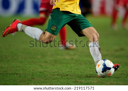 NONTHABURI THAILAND-SEPTEMBER 17:Foot ball being kicked on lawn the ball during the AFC U-16 Championship between Australia and DPR Korea at  Rajamangala Stadium on Sep17,2014,Thailand
