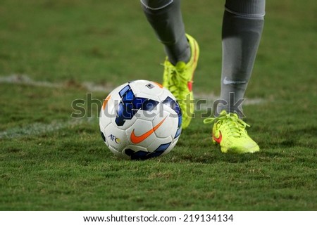 NONTHABURI THAILAND-SEPTEMBER 17:foot in close up of soccer cleats  during the AFC U-16 Championship between Australia and DPR Korea at  Rajamangala Stadium on Sep17,2014,Thailand
