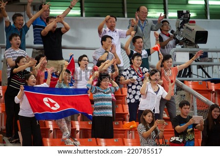 NONTHABURI THAILAND-SEPTEMBER 17:Unidentified fans of DPR Korea celebrates during the AFC U-16 Championship between Australia and DPR Korea at Rajamangala Stadium on Sep17,2014,Thailand