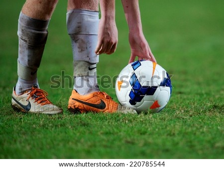 NONTHABURI THAILAND-SEPTEMBER 17:foot in close up of soccer cleats during the AFC U-16 Championship between Australia and DPR Korea at Rajamangala Stadium on Sep17,2014,Thailand