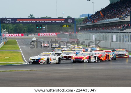 BURIRAM THAILAND-OCTOBER 5:Jorg Muller (L) of BMW Sports Trophy Team Studie locks up at the start of the Autobacs Super GT Round7 at Chang International Circuit,on Oct 05,2014 in,Thailand