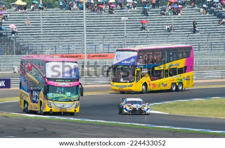 BURIRAM THAILAND-OCTOBER 5:Two big bus for press drives during circuit safari the Autobacs Super GT Round7 Burirum United Super GT Raceat Chang International Circuit,on Oct 05,2014 in,Thailand