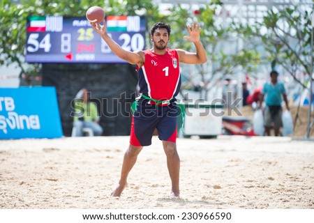PHUKET,THAILAND-NOVEMBER 13:Fahad Albahri no.1 of Kuwait throws the football during Beach Flag Football Kuwait and India during the 2014 Asian Beach Games at Saphan Hin on Nov 13,2014 in Thailand.