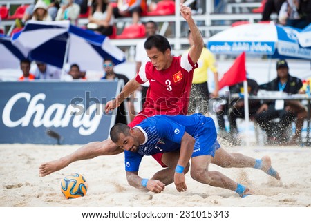 PHUKET THAILAND-NOVEMBER15:Tran Van Hoa (RED) of Vietnam in action during the Beach Soccer match between Kuwait and Vietnam the 2014 Asian Beach Games at Saphan Hin on Nov 15,2014 in Thailand