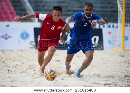 PHUKET THAILAND-NOVEMBER15:Phung Ngoc Vinh Quy  (RED) of Vietnam in action during the Beach Soccer match between Kuwait and Vietnam the 2014 Asian Beach Games at Saphan Hin on Nov 15,2014 in Thailand