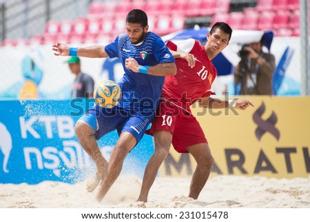 PHUKET THAILAND-NOVEMBER15:Saud Aloun (L) of Kuwait in action during the Beach Soccer match between Kuwait and Vietnam the 2014 Asian Beach Games at Saphan Hin on November15,2014 in Thailand