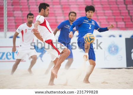 PHUKET THAILAND-NOVEMBER19:Shahriar Mozhedh Rrudsari (L)of Iran in action during the Beach Soccer match between Thailand and Iran the 2014 Asian Beach Games at Saphan Hin on Nov 19,2014 in Thailand