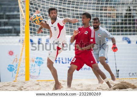 PHUKET THAILAND-NOVEMBER20 :Mohammad Ahmadzadeh (L) of Iran for the ball during the Beach Soccer match between UAE and Iran the 2014 Asian Beach Games at Saphan Hin on Nov 20,2014 in Thailand