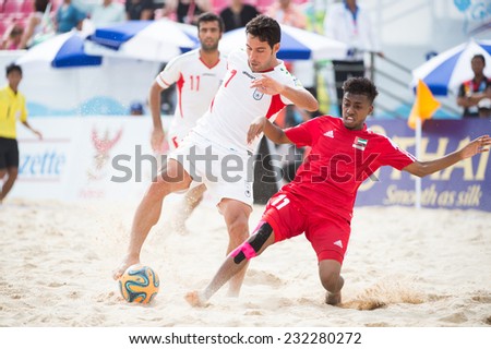 PHUKET THAILAND-NOVEMBER20 :Shahriar Mozhedh Roudsari (L) of Iran in action during the Beach Soccer match between UAE and Iran the 2014 Asian Beach Games at Saphan Hin on Nov 20,2014 in Thailand