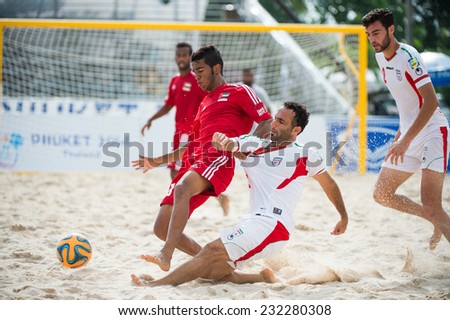 PHUKET THAILAND-NOVEMBER20 :Farid Boulokbashi no.8 (R)of Iran in action during the Beach Soccer match between UAE and Iran the 2014 Asian Beach Games at Saphan Hin on Nov 20,2014 in Thailand