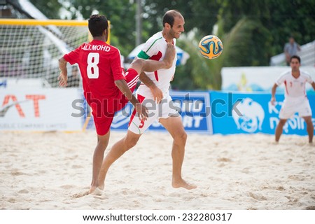 PHUKET THAILAND-NOVEMBER20 :Ali Naderi Hosseinabadi  (R)of Iran in action during the Beach Soccer match between UAE and Iran the 2014 Asian Beach Games at Saphan Hin on Nov 20,2014 in Thailand
