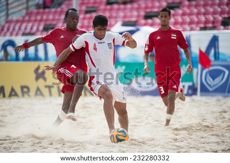 PHUKET THAILAND-NOVEMBER20 :Mehdi HassanInoznri no.4 of Iran in action during the Beach Soccer match between UAE and Iran the 2014 Asian Beach Games at Saphan Hin on Nov 20,2014 in Thailand