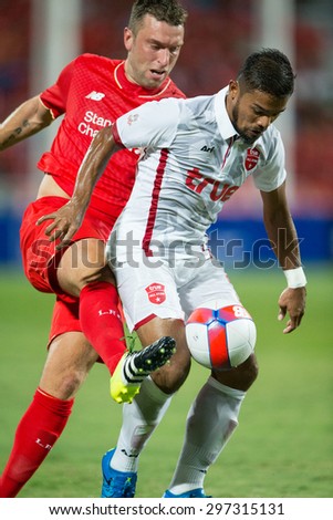BANGKOK THAILAND JULY14:Prathom Chotong(R)of Thai All Stars in action during the international friendly match between Thai All Stars and Liverpool FC at Rajamangala Stadium on July14,2015 in,Thailand.