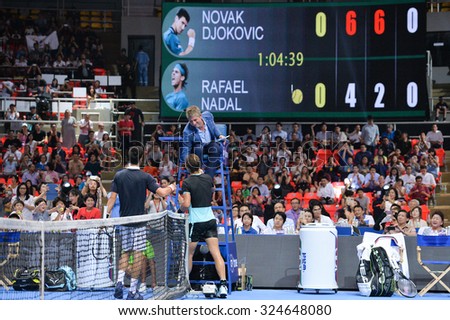 BANGKOK THAILAND OCTOBER 02: Chair Umpire John Blom (top) handshake with players after match during the Black to Thailand Nadal vs Djokovic exhibition match at  Indoor Stadium on Oct 2,2015 in,Thailand.