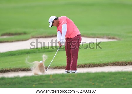NAKHONPATHOM,THAILAND - AUG 12:Panuphol Pittayarat of THA in action during day two of the 2011 Thailand Open at Suwan Golf&Country Club on August 12, 2011 in Nakhonpathom Thailand