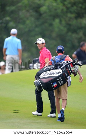 CHONBURI, THAILAND - DECEMBER 15:Gregory BOURDYof France plays a shot during day one of the Thailand Golf Championship at Amata Spring Country Club on December 15, 2011 in Chonburi, Thailand.