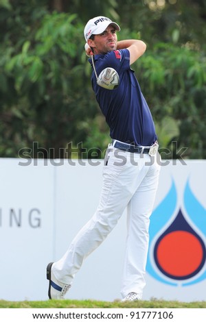 CHONBURI,THAILAND - DECEMBER 15:John Parry of England plays a shot during day one of the Thailand Golf Championship at Amata Spring Country Club on December 15, 2011 in Chonburi, Thailand.