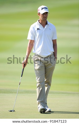 CHONBURI,THAILAND - DECEMBER 15: Rikard KARLBERG of SWE plays a shot during day one of the Thailand Golf Championship at Amata Spring Country Club on December 15, 2011 in Chonburi, Thailand.