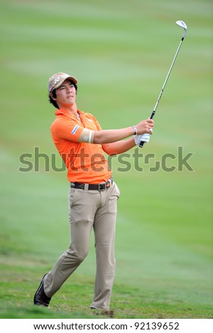 CHONBURI,THAILAND - DECEMBER 16:Ryo ISHIKAWA of Japan in action during day two of the Thailand Golf Championship at Amata Spring Country Club on December 16, 2011 in Chonburi province, Thailand.