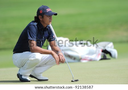 CHONBURI, THAILAND - DECEMBER 16:Hiroshi IWATA of Japan in action during day two of the Thailand Golf Championship at Amata Spring Country Club on December 16, 2011 in Chonburi province, Thailand.