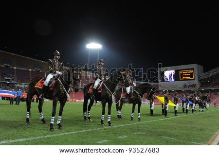 BANGKOK THAILAND-JAN15:Thai soldiers ride on horse during opening ceremony at 41st King\'s cup football between Thailand(Y) and KoreaRep(R)at Rajamangala stadium on Jan15,2012 in Bangkok,Thailand.