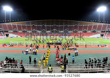 BANGKOK THAILAND-JAN15:Thailand and Korea Rep walk in to stadium.Before start games 41st King\'s cup football between Thailand(Y)and Korea Rep(R)at Rajamangala stadium on Jan15,2012 in BangkokThailand.