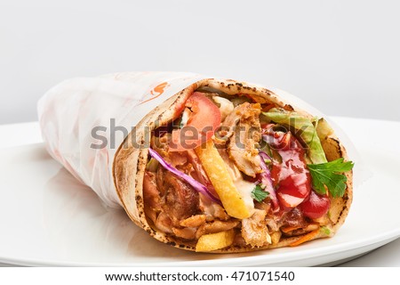 shawarma with sauce on white background