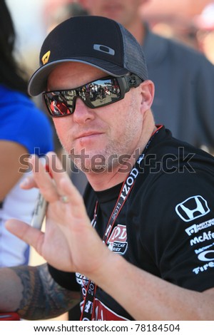 LONG BEACH, CA - APRIL 15: Pro racer, Paul Tracy signs autographs for fans at this year\'s Grand Prix in Long Beach, CA on April 15, 2011.