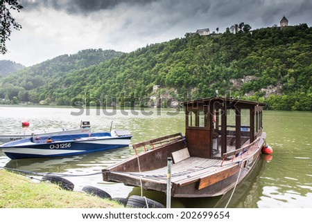 WACHAU VALLEY,AUSTRIA-MAY 9,2014:Boats moored on the river Danube along the bike path on a cloudy day