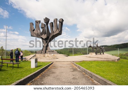 MAUTHAUSEN,AUSTRIA-MAY 10,2014:people admire  the  Russian monument before entering the camp during a cloudy day